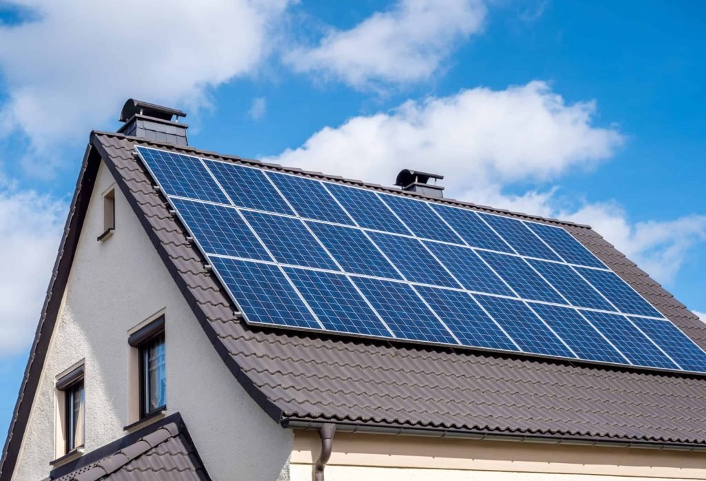 white home scallop roof and solar panels shutterstock 1336991930 scaled 1 scaled